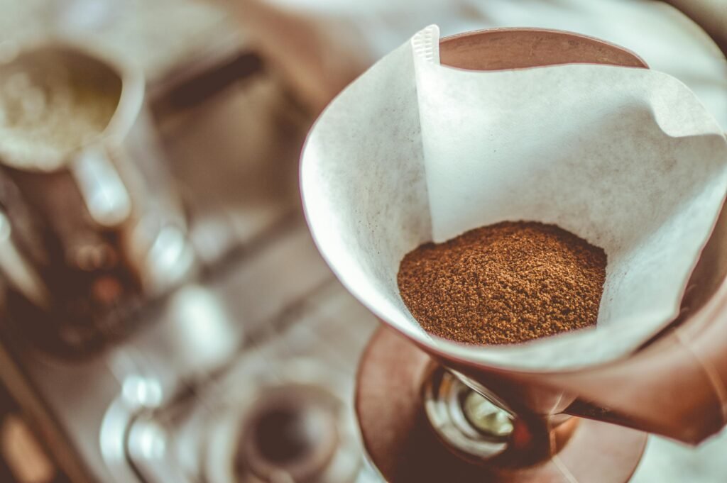 pexels-photo-69976-69976 A close-up of ground coffee in a pour-over filter on a stovetop background, ideal for coffee enthusiasts.